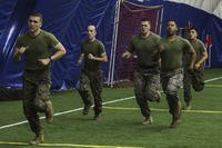 Marine recruiters sprint 880 meters during a combat fitness test.