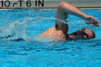 An airman swims laps.