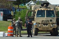 National Guardsmen guard a street near a high school in Kenosha, Wis., after the shooting of Jacob Blake.