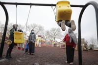 Afghan refugee mothers and children play in a park in Liberty Village on Joint Base McGuire-Dix- Lakehurst