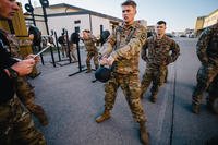 Paratroopers perform kettlebell swings.