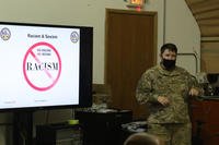 Staff Sgt. Christen Ross talks to a EOLC class about racism in Kuwait