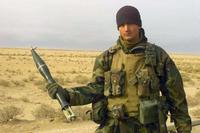 U.S. Marine Corps Corporal Tyson Manker displays a PG-76 anti-tank grenade.