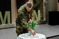 Army Chief of Staff Lars Lervik lights candles for the Marines killed during an exercise in Norway.