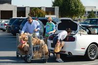 Family loads groceries at the commissary at Dover Air Force Base.