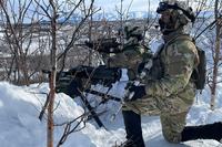 Scouts on the lookout for enemy Strykers during a training exercise in Alaska.