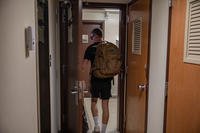 U.S. Army Pfc. Riley Norris, 505th Parachute Infantry Regiment, 3rd Brigade Combat Team, 82nd Airborne Division, packs his bags and walks out of his room at Smoke Bomb Hill indefinitely, Fort Bragg, N.C.