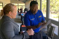 A military spouse has her resume reviewed by a certified career counselor at the MilSpo Career Expo at Fort Bragg, N.C.