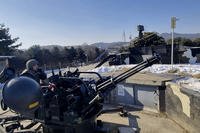 South Korean soldiers operate a vulcan automatic cannon during a military exercise in Yangju