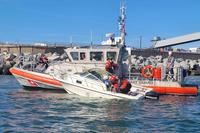 Coast Guard Station Little Creek dewatering a 22-foot recreational vessel.