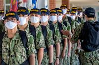 Recruit chief petty officer does a count of his division as they prepare to march.