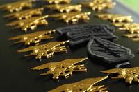 Navy SEAL Tridents pounded into a casket as part of a 2010 funeral.