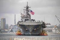 Amphibious assault carrier USS Tripoli transits San Diego Harbor.