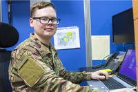 A human resources specialist works at his desk.