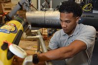 Naval Surface Warfare Center Panama City Division mechanical engineer Louis Lee carries out routine inspections on the unmanned underwater vehicles at the NSWC PCD Littoral Warfare Research Complex.