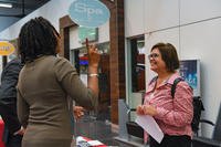 A representative from Wiesbaden First Command, an organization that offers financial services to the community, talks with one of the attendees at the Army Community Service job fair on Hainerberg, Wiesbaden, Hessen, DE.