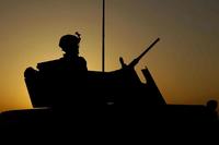 Silhouette of an artillery soldier.