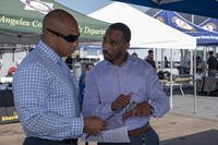 Sonar Technician (Surface) 1st Class Jason Baldwin, left, assigned to Naval Medical Center San Diego, speaks with Los Angeles Metro Veterans Program Manager Dennis Tucker aboard the Battleship Iowa Museum as part of a job fair during Los Angeles Fleet Week.