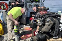 team preparing to dive the wreck of the 92-foot attack submarine Defender