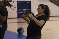 U.S. Air Force Senior Airman Alexandra Singer performs a TRX row exercise at Joint Base Langley-Eustis, Virginia.