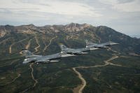 Three U.S. Air Force F-16 Vipers, assigned to the 421st Fighter Squadron and the 388th and 419th Fighter Wings from Hill Air Force Base, Utah, fly over the Wasatch Mountain range.
