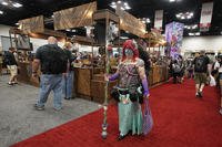 Attendees walk through the Gen Con convention at the Indiana Convention Center in Indianapolis.