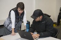 Regan Hertzler conducts an Onward to Opportunity (O2O) orientation session with Petty Officer 1st Class Joel Pichardo in Norfolk, Virginia.