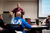 A Pennington County Veterans Service Office staff member discusses VA benefits available to airmen during a Transition Assistance Program class on Ellsworth Air Force Base, S.D.