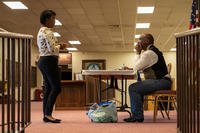 Oran Brown, right, founder of a company that holds career fairs for veterans, advises a job seeker during a career fair for veterans in San Diego.