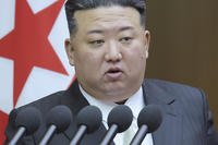 North Korean leader Kim Jong Un speaks at a meeting