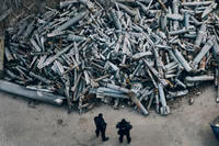 Police officers look at collected fragments of the Russian rockets in Ukraine