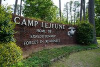 Marine DeathsSignage stands on the main gate to Camp Lejeune Marine Base outside Jacksonville, N.C.