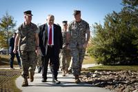 Marine Corps leadership walk toward barracks on Camp Lejeune
