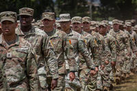 25th Infantry Division soldiers conduct pass in review during the division change of command ceremony at Schofield Barracks, Hawaii.