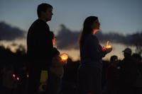 Mourners attend a candlelight vigil in Lisbon Falls, Maine, for the victims of the mass shootings in nearby Lewiston. 