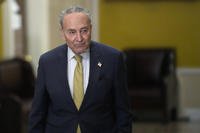 Senate Majority Leader Chuck Schumer of N.Y., walks to talk with reporters following a meeting with Ukrainian President Volodymyr Zelenskyy and other senators
