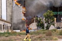 Firefighters battle a fire at the former Marine Corps Air Station Tustin