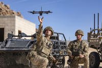 British soldiers launch a drone during Project Convergence exercises at Fort Irwin