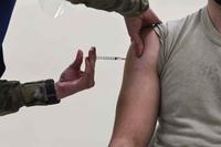 Airman receives his first shot of the Pfizer-BioNTech COVID-19 vaccine