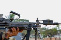 A U.S. Army infantryman grips his M249 light machine gun