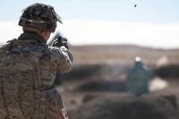 A cavalry scout fires the M17 9mm pistol at Fort Carson