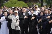 South Korean President Yoon Suk Yeol, center left, and his wife Kim Keon Hee