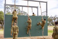 students climb a wall at the Recruit Training Unit course at Royal Australian Air Force (RAAF) Base in Wagga