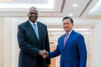 U.S. Defense Secretary Lloyd Austin, left, shakes hands with Cambodian Prime Minister Hun Manet