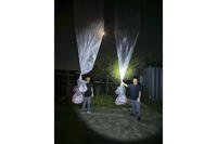 North Korean defector Park Sang-hak, left, and a member of Fighters For A Free North Korea hold balloons