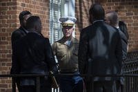 U.S. Marine Corp Major Joshua Mast, center, talks with his attorneys