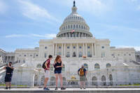 Visitors stand outside of the U.S Capitol.