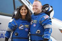 NASA astronauts Suni Williams, left, and Butch Wilmore stand together