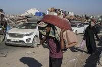 A Palestinian youth flees the Khan Younis area of the Gaza Strip