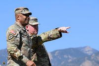 Then-Garrison Commander Col. Sean Brown points out improvements across Fort Carson